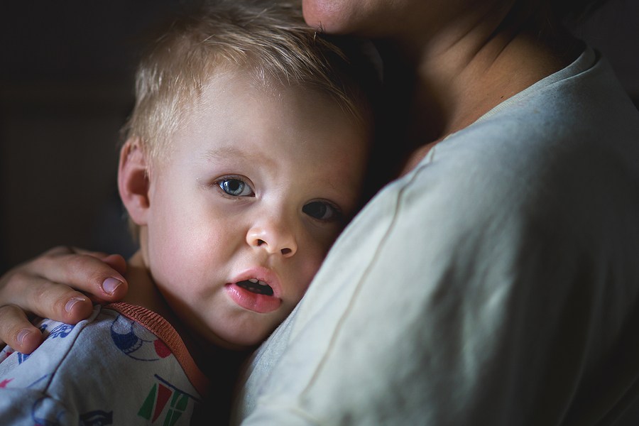 A parent hugging the child