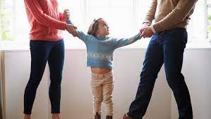 Mother and father in a heated discussion over child custody with their daughter in the background, depicting the emotional complexities of family law cases